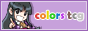 A purple button featuring Maya Fey – an anime girl wearing a psychic medium's outfit – as well as the words colors tcg in a rainbow font.